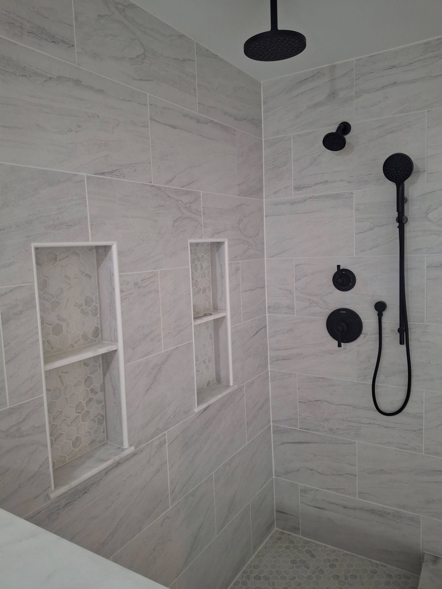 Tile shower with matte black fixtures